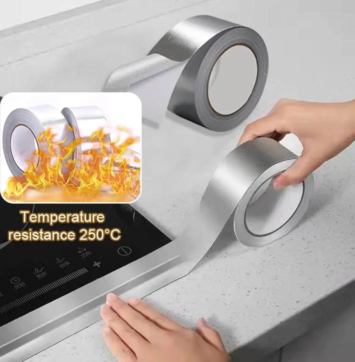 Silver high-temperature resistant aluminum foil tape being applied along a kitchen stove counter edge, featuring a flame graphic highlighting 250°C resistance, available at ZoniStores Pakistan