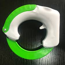 Green and white circular rolling knife and vegetable chopper from Zoni Stores Pakistan.